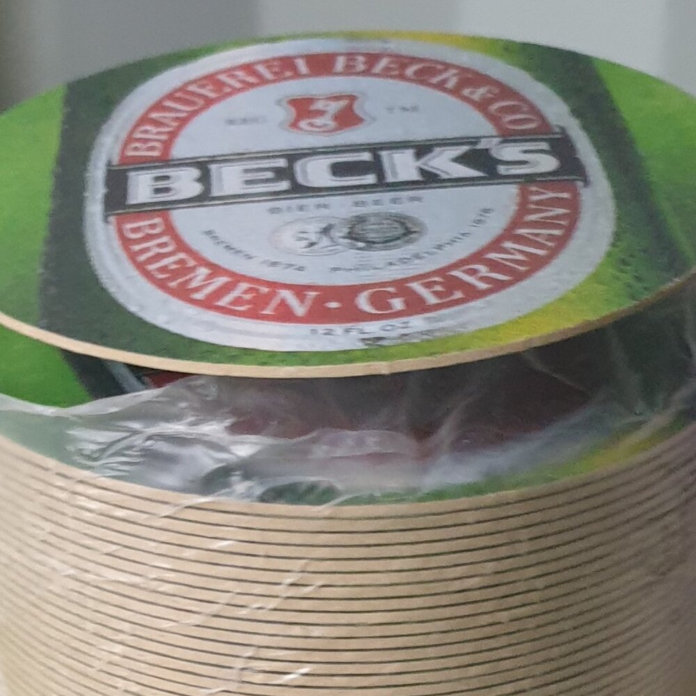 Lot of over 60 Becks Beer Heavy Round Cardboard Coasters NEW in Roll Beck's